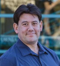 Picture of a white man wearing a blue shirt